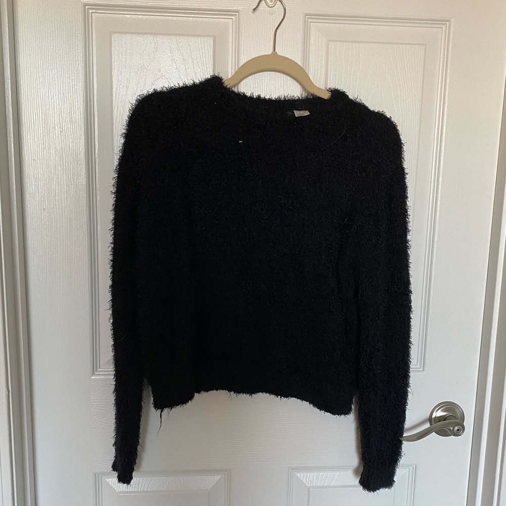Fuzzy black Divided sweater. Size small, fits more like an XS.